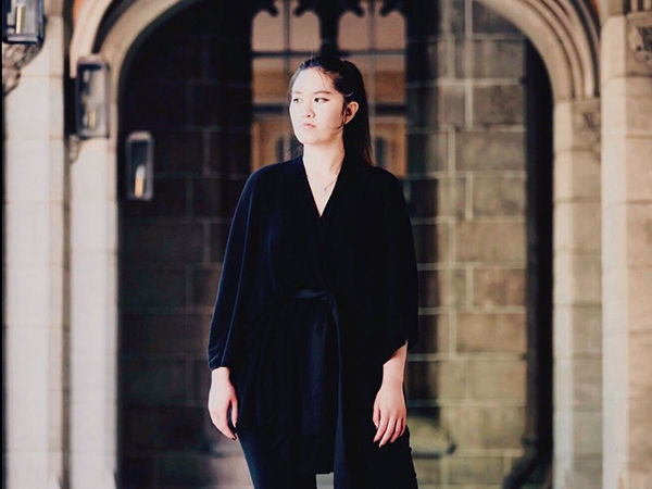Sonia standing in the Old Quad