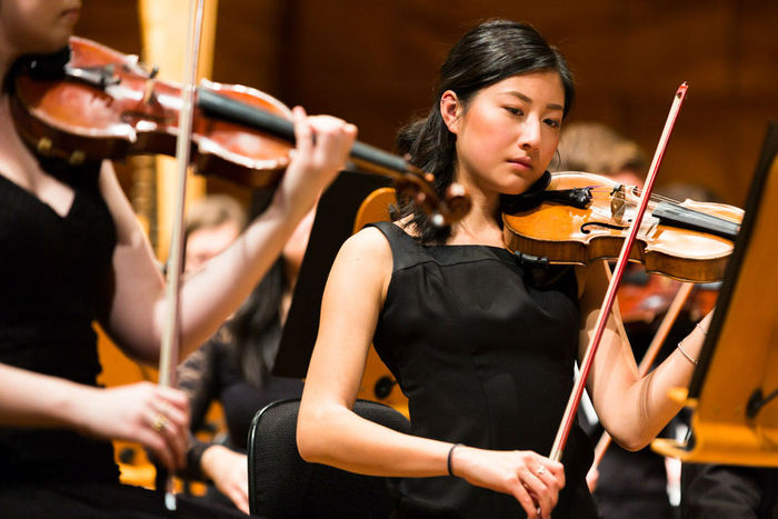 Violinist plays in the University of Melbourne Symphony Orchestra in 2017.