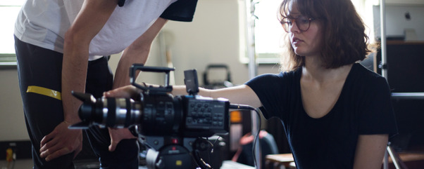 Film and TV short course students working with a camera.